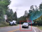 Goofball on Mitchell Rd swings wide going around blind corner, nearly collides head-on with pizza delivery driver.