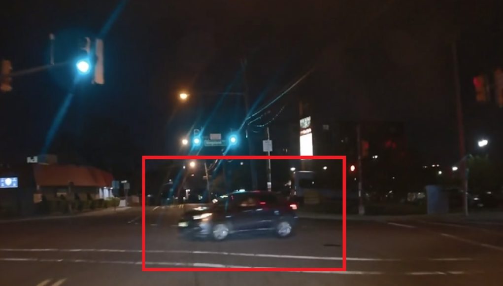 Goofball waiting to turn onto Riverside from Kingsland runs the red just as dashcam owner gets the green to go.