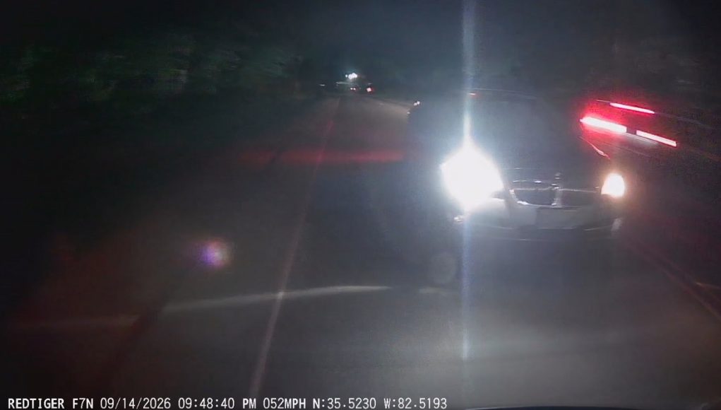 Reckless BMW driver caught on Sweeten Creek attempting risky overtake without yielding properly.