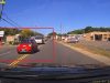 Goofball exiting Post Office botches left turn then forces their way in front of fast approaching tow truck.