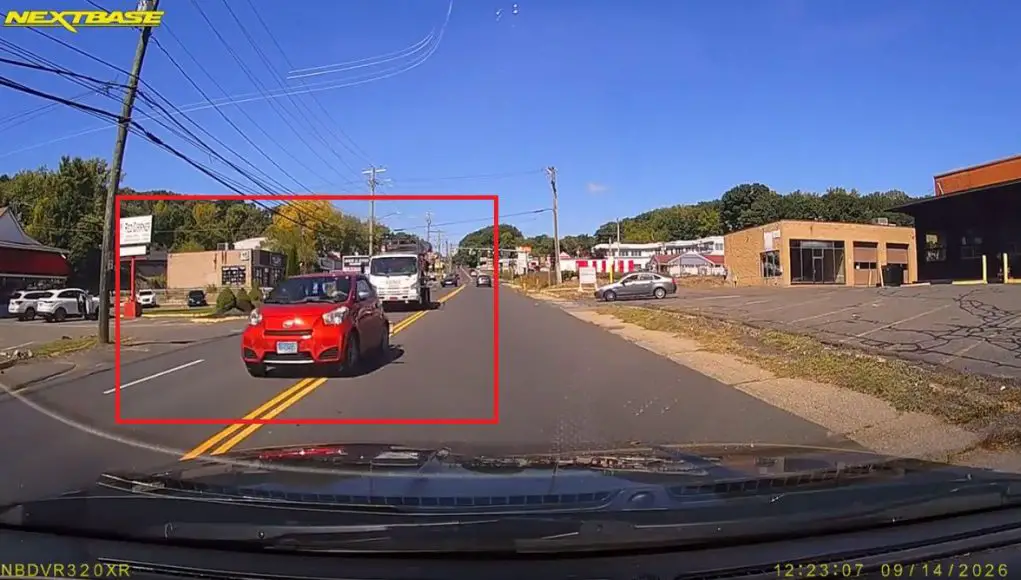 Goofball exiting Post Office botches left turn then forces their way in front of fast approaching tow truck.