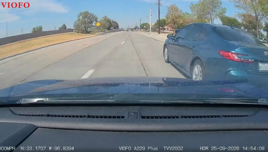 No look lane change on Dallas Parkway ends in near collision and instant justice from Frisco Police.