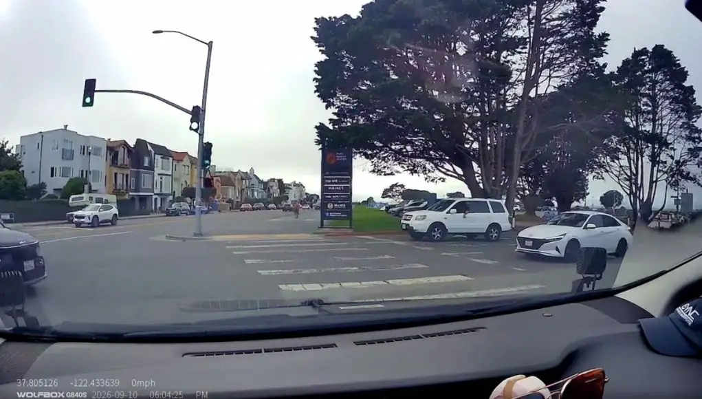tries to cut-off driver with the right of way fort mason center-C Turner tries to steal right of way from dashcam owner and has the nerve to honk at them for waiting for pedestrians to cross.