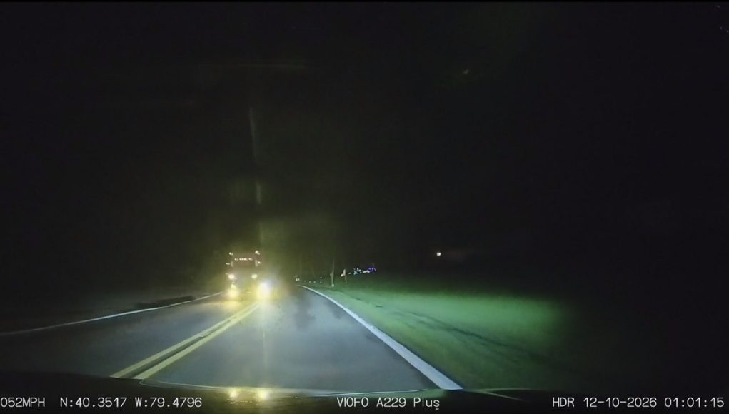 Doofus pulls off blind overtake, in the dark morning hours, over double solid yellows.
