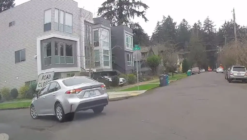 Driver on turning from Jarrett isn't paying attention, slams into Road Closed sign on NE 24th St.