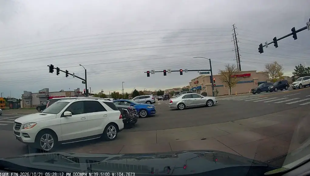 Parker CO collision beating red light Doofus tries to beat the red turning from Twenty Mile Rd. Gets clipped by Escalade resulting in thousands in damage.