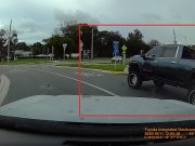 Doofus in lifted Denali towing a fan boat doesn't know how roundabouts work, nearly causes crash.